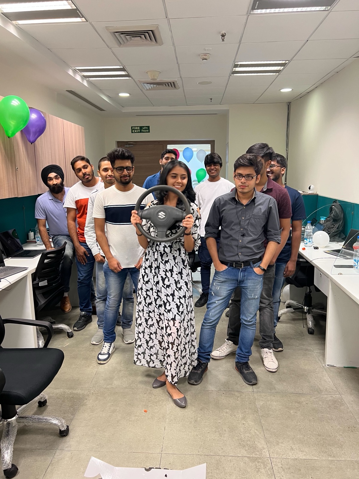 CarInfo team with steering wheel